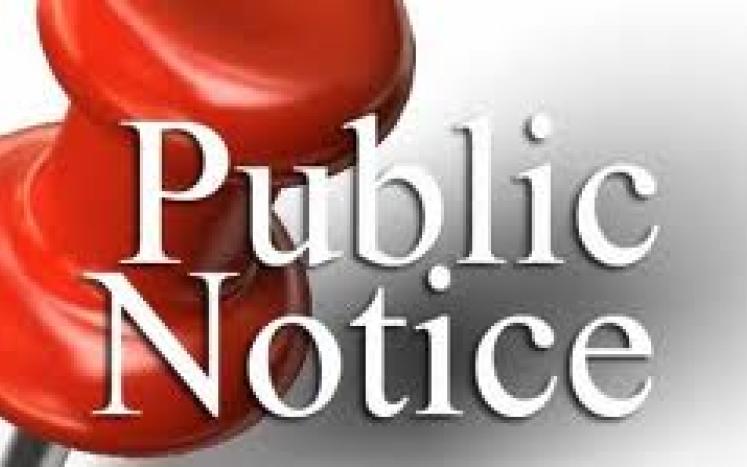 Push pin photo with public notice text